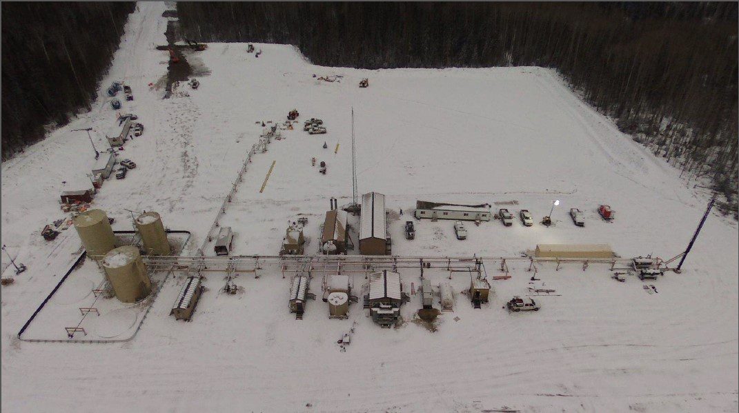 Aerial view of a snow-covered oil battery site