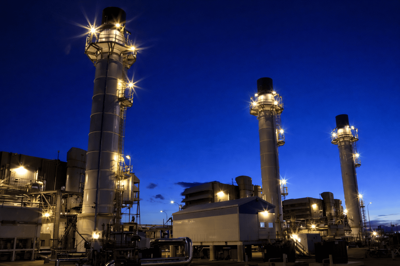 Gas processing facility illuminated at night